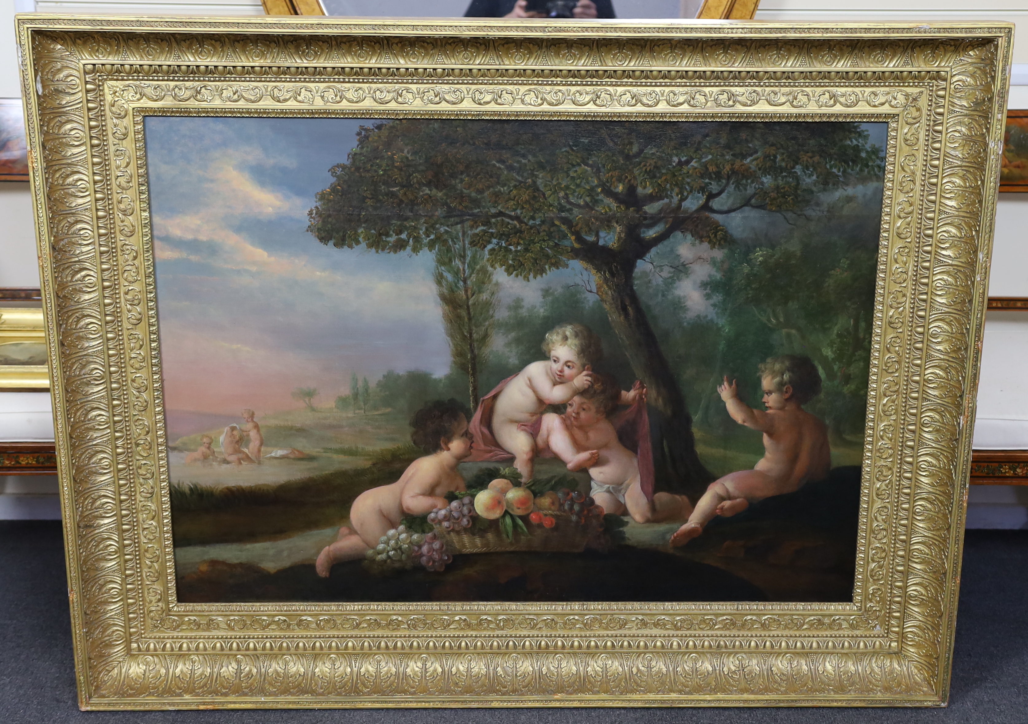 19th century French School, Putti in a landscape, oil on canvas, 80 x 112cm